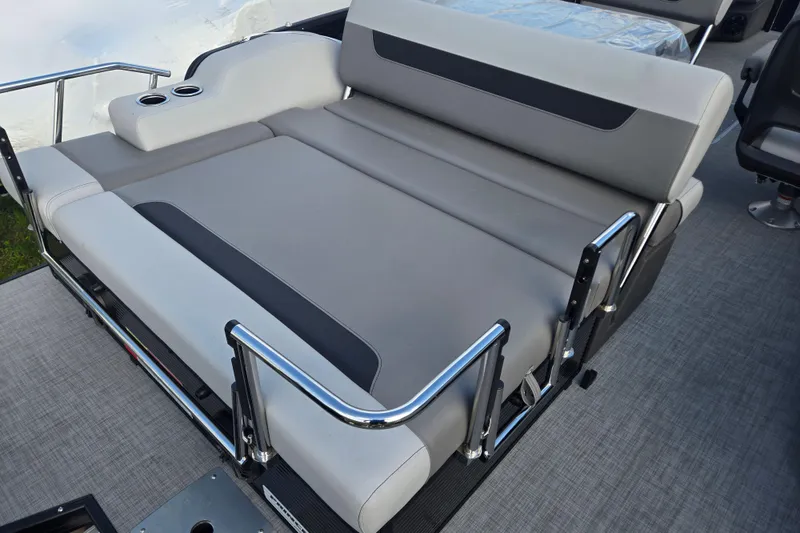 Slide: The Image of 2026 Princecraft Vectra 23 RL boat with gray cushioned seating and stainless steel railings. - 5
