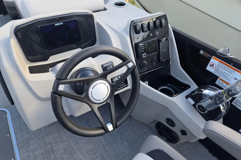Slide: The Image of Steering console of 2026 Princecraft Vectra 23 RL boat with modern controls and display. - 7