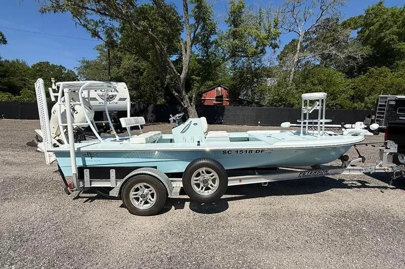 Slide: The Image of 2016 Beavertail Skiffs Vengeance boat on trailer, parked outdoors. - 10