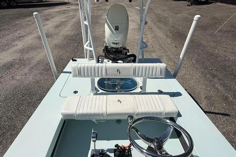 Slide: The Image of 2016 Beavertail Skiffs Vengeance boat interior with steering wheel and seating. - 11