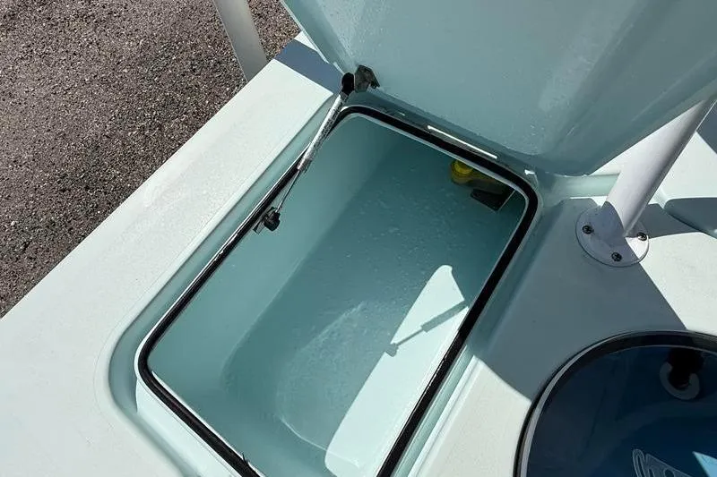 Slide: The Image of Open storage compartment on a 2016 Beavertail Skiffs Vengeance boat. - 12