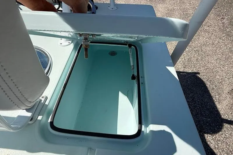 Slide: The Image of 2016 Beavertail Skiffs Vengeance boat compartment with open hatch, showcasing interior details. - 15