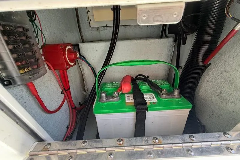 Slide: The Image of Battery compartment of a 2016 Beavertail Skiffs Vengeance with wiring and connections. - 18