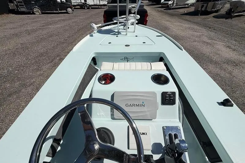 Slide: The Image of 2016 Beavertail Skiffs Vengeance boat interior with Garmin navigation system and Suzuki controls. - 19