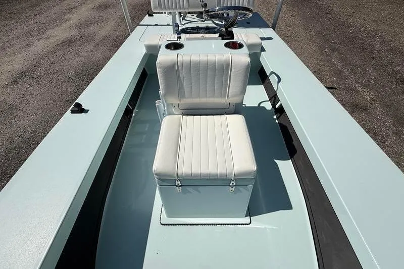 Slide: The Image of 2016 Beavertail Skiffs Vengeance boat interior with white seating and steering console. - 20