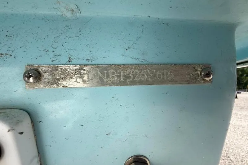 Slide: The Image of 2016 Beavertail Skiffs Vengeance hull identification number plate on light blue surface. - 24