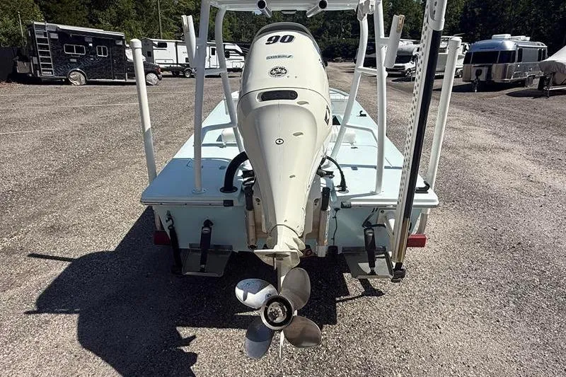 Slide: The Image of 2016 Beavertail Skiffs Vengeance boat with outboard motor in a parking area. - 3