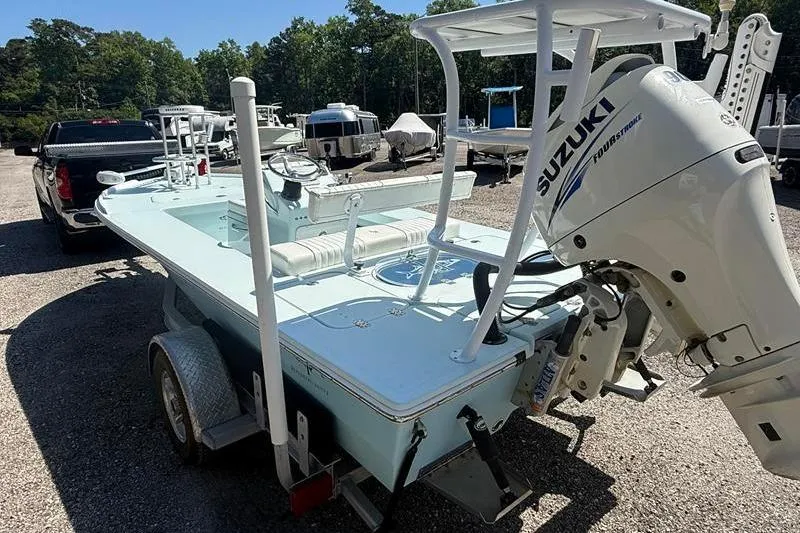 Slide: The Image of 2016 Beavertail Skiffs Vengeance boat with Suzuki outboard motor on a trailer. - 4