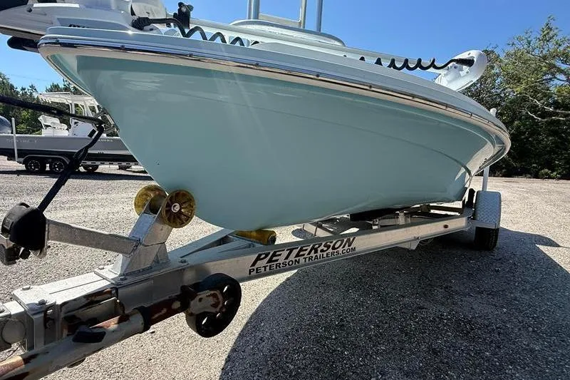 Slide: The Image of 2016 Beavertail Skiffs Vengeance on Peterson trailer, parked outdoors. - 7