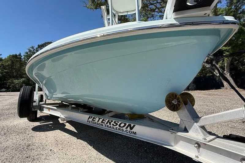 Slide: The Image of 2016 Beavertail Skiffs Vengeance on Peterson trailer, parked outdoors. - 9