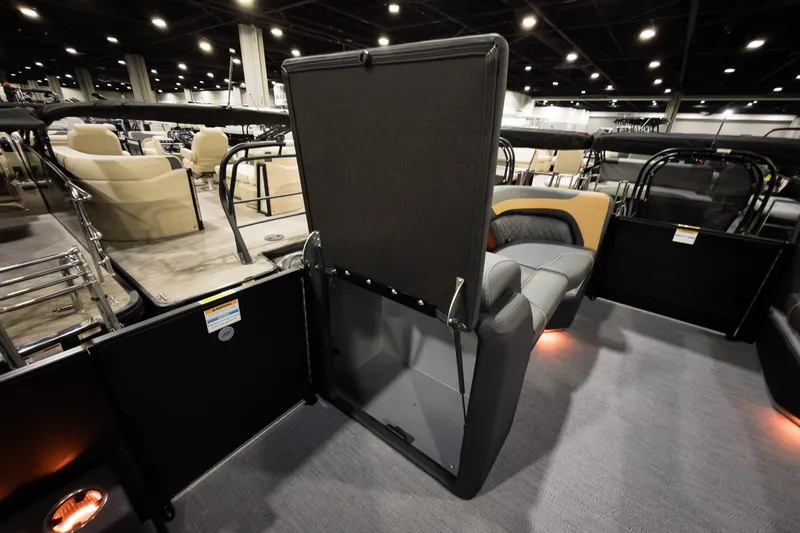 Slide: The Image of 2026 Godfrey Sweetwater 22' Tritoon with flip lounge, showcased indoors. - 16
