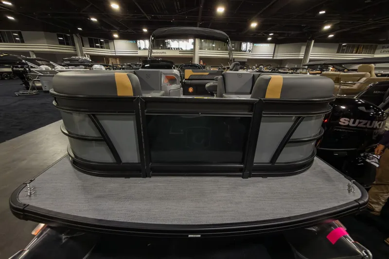 Slide: The Image of 2026 Godfrey Sweetwater 22' Tritoon boat with single flip lounge, showcased indoors. - 4