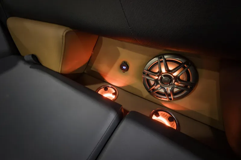 Slide: The Image of Interior of 2026 Godfrey Sweetwater Tritoon with illuminated speakers and seating. - 7