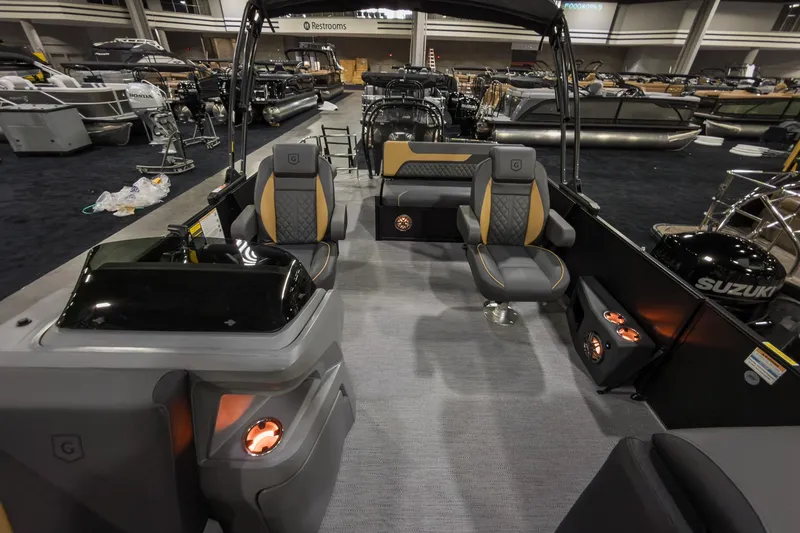 Slide: The Image of Interior of 2026 Godfrey Sweetwater 22' Tritoon with luxurious seating and modern design. - 9