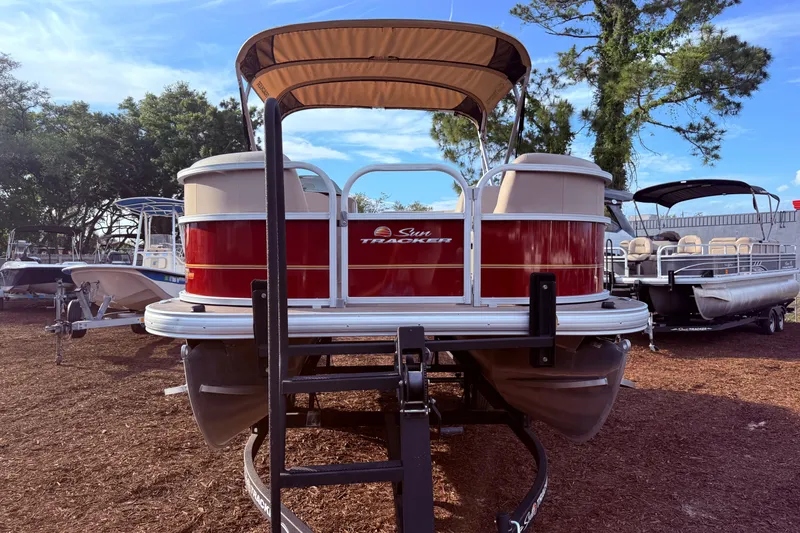Slide: The Image of 2023 Sun Tracker Party Barge 18 DLX pontoon boat displayed outdoors. - 3