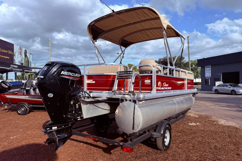 Slide: The Image of 2023 Sun Tracker Party Barge 18 DLX pontoon boat with Mercury outboard motor. - 4