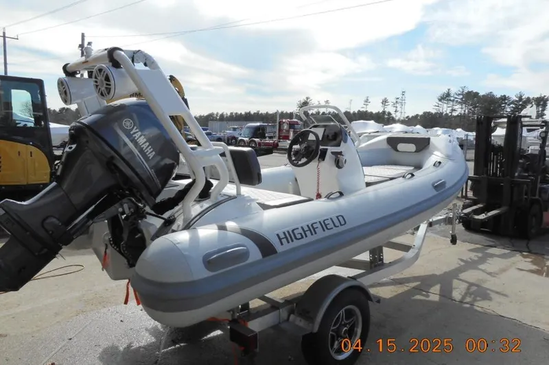 Slide: The Image of 2025 Highfield Sport 420 boat with Yamaha engine on trailer, outdoor setting. - 3