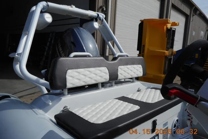 Slide: The Image of 2025 Highfield Sport 420 boat interior with cushioned seating and steering wheel. - 5