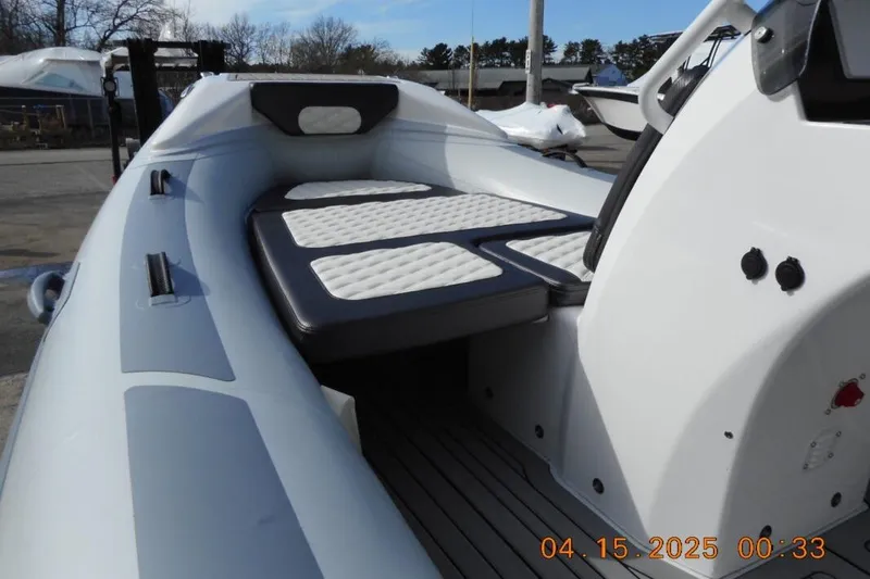 Slide: The Image of 2025 Highfield Sport 420 boat interior with cushioned seating and sleek design. - 8