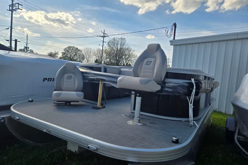 The Image of 2026 Princecraft Jazz 19-4S pontoon boat with seating, parked outdoors. - 0