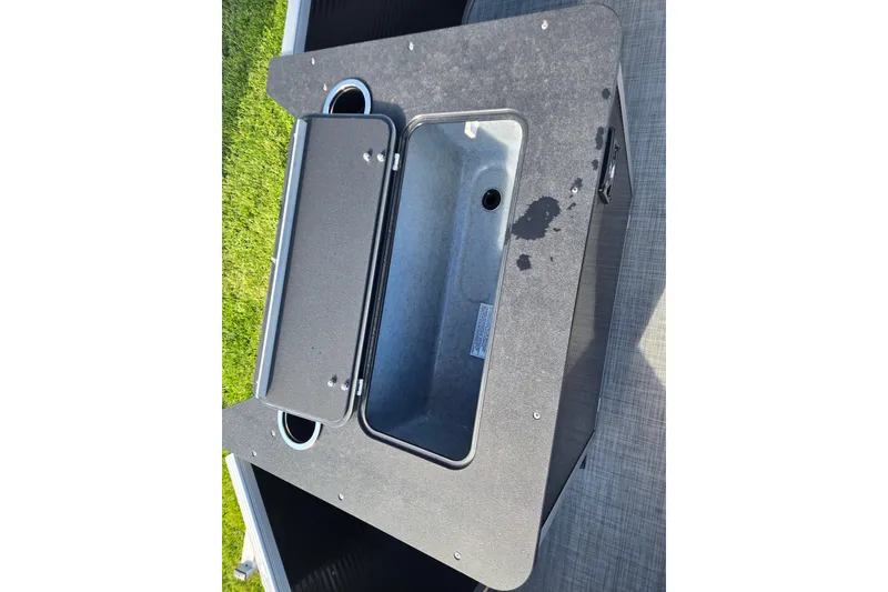 Slide: The Image of Open storage compartment on 2026 Princecraft Jazz 19-4S boat, featuring a sleek design. - 8