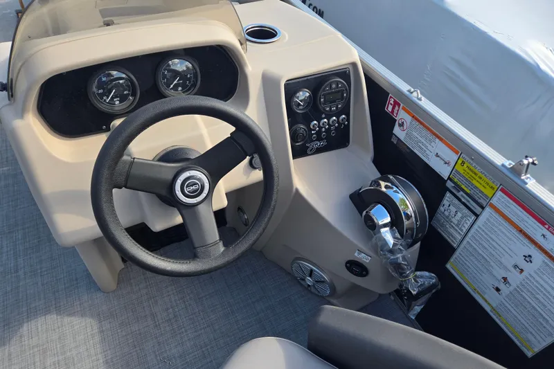 Slide: The Image of Steering console of 2026 Princecraft Jazz 19-4S boat with gauges and controls. - 9
