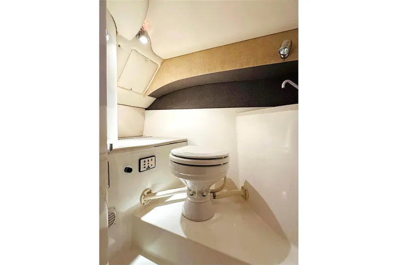 Slide: The Image of 2005 Cobalt 343 boat interior bathroom with toilet and modern fixtures. - 12