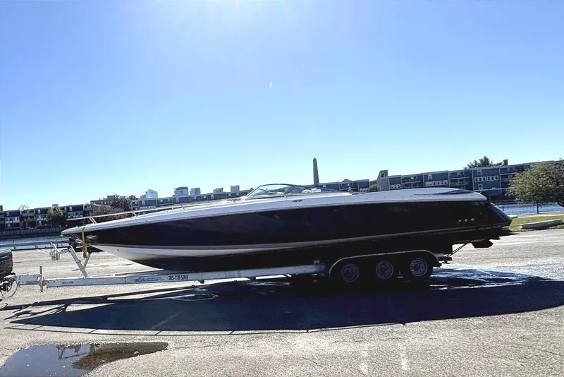 Slide: The Image of Truck towing a 2005 Cobalt 343 boat under a clear blue sky. - 18