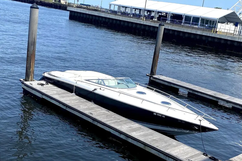 Slide: The Image of 2005 Cobalt 343 boat docked at harbor. - 2