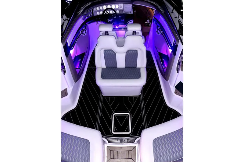 Slide: The Image of Luxurious interior of a 2005 Cobalt 343 boat with ambient purple lighting. - 4
