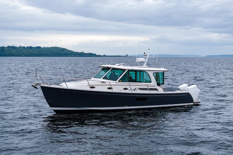 The Image of 2025 Back Cove 39O boat on open water, showcasing sleek design and modern features. - 0