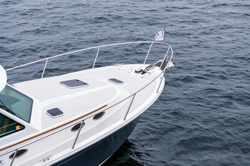 Slide: The Image of 2025 Back Cove 39O yacht bow on water, showcasing sleek design and craftsmanship. - 14
