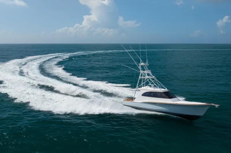 The Image of 2015 Jarrett Bay Hardtop Express Sportfish cruising on open ocean waters. - 0