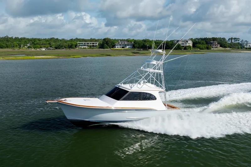Slide: The Image of 2015 Jarrett Bay Hardtop Express Sportfish cruising on a scenic waterway. - 1