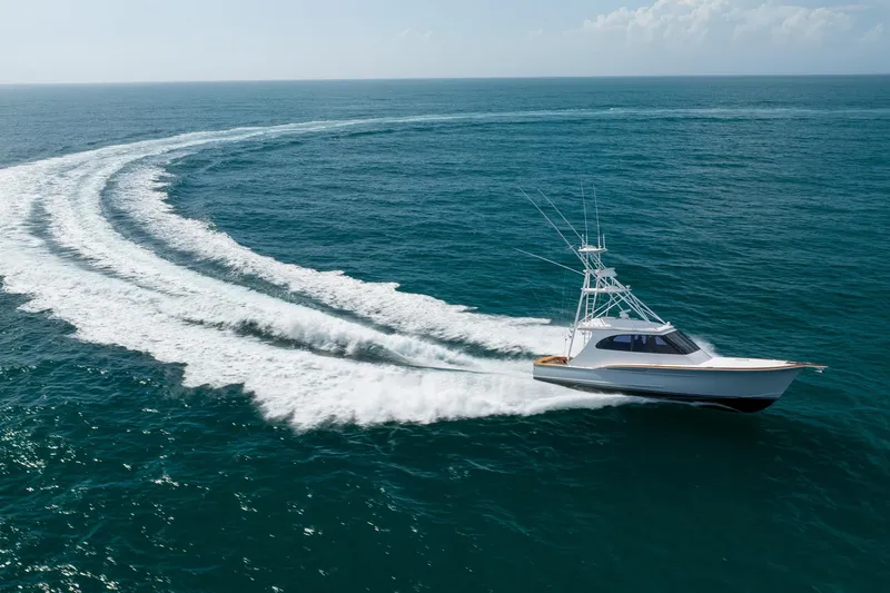 Slide: The Image of 2015 Jarrett Bay Hardtop Express Sportfish cruising on open ocean, leaving a wake trail. - 114