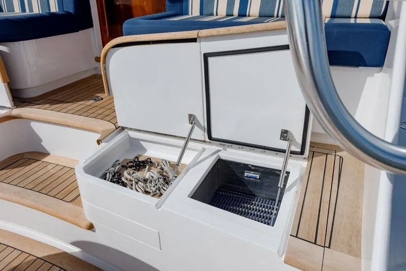 Slide: The Image of 2015 Jarrett Bay Hardtop Express Sportfish deck with open storage compartments. - 19