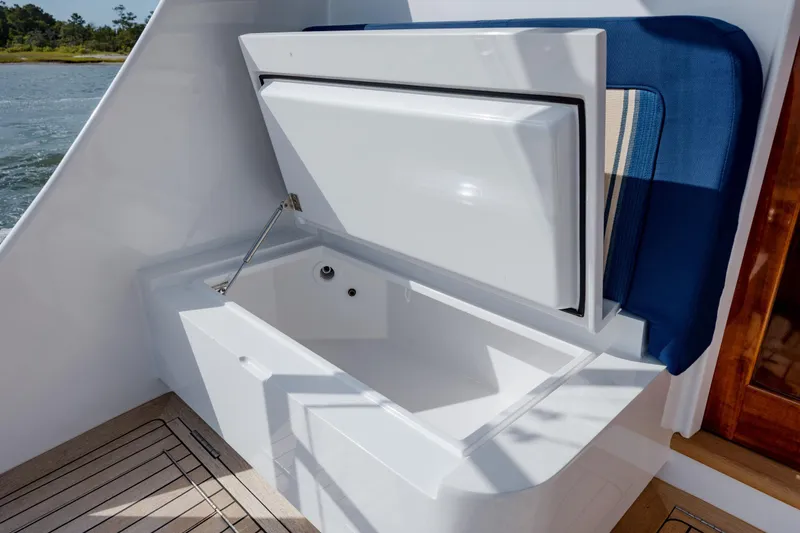 Slide: The Image of 2015 Jarrett Bay Hardtop Express Sportfish with open storage compartment on deck. - 22