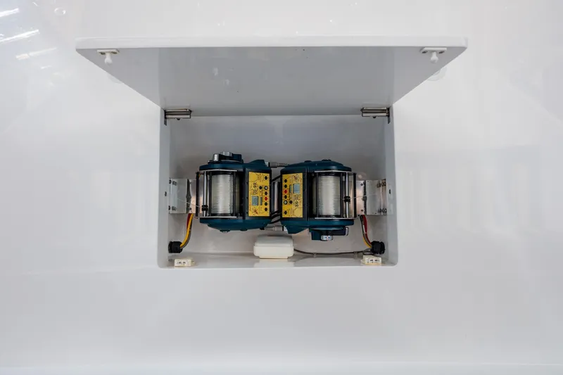 Slide: The Image of Electrical components inside a compartment of a 2015 Jarrett Bay Hardtop Express Sportfish boat. - 25
