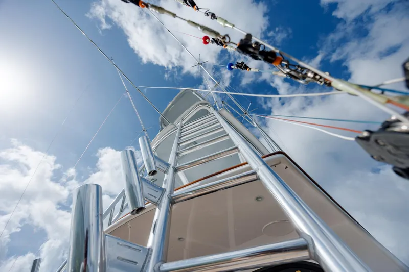 Slide: The Image of 2015 Jarrett Bay Hardtop Express Sportfish yacht ladder against a bright blue sky. - 26