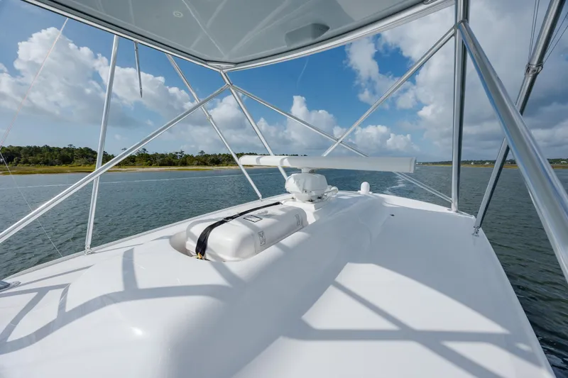 Slide: The Image of 2015 Jarrett Bay Hardtop Express Sportfish on calm waters under a blue sky. - 27