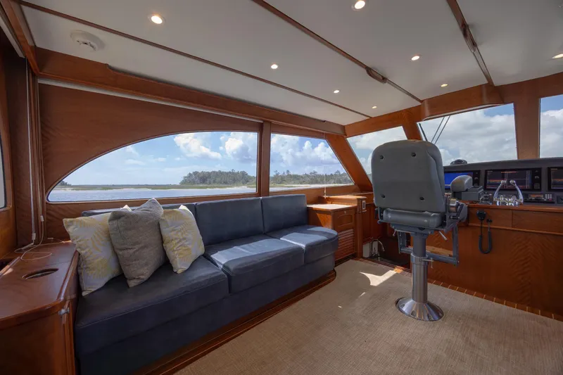 Slide: The Image of Luxurious interior of 2015 Jarrett Bay Hardtop Express Sportfish with plush seating and helm. - 37