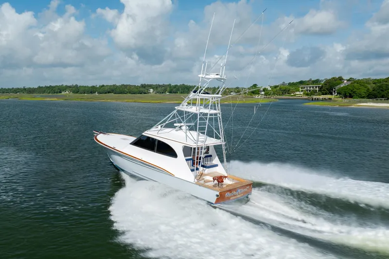 Slide: The Image of 2015 Jarrett Bay Hardtop Express Sportfish cruising on a scenic waterway. - 65