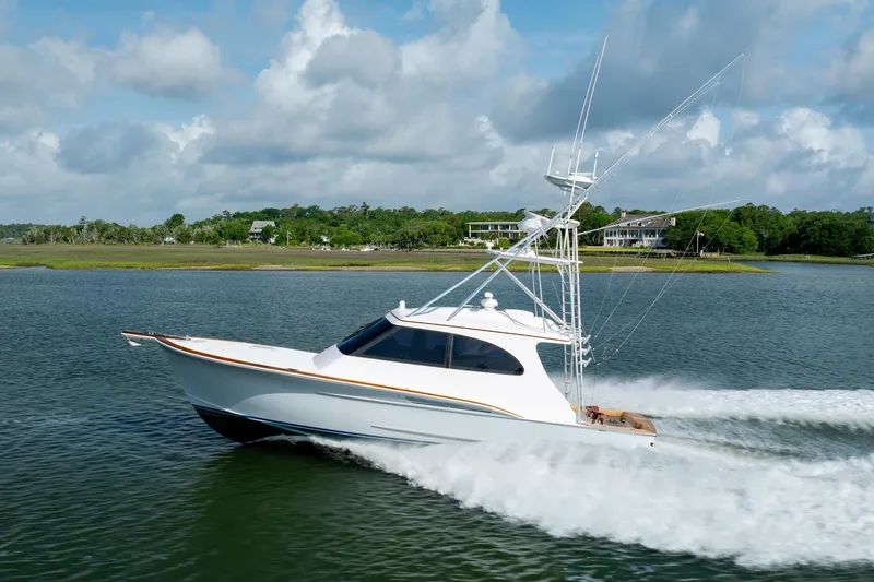 Slide: The Image of 2015 Jarrett Bay Hardtop Express Sportfish cruising on a scenic waterway. - 66