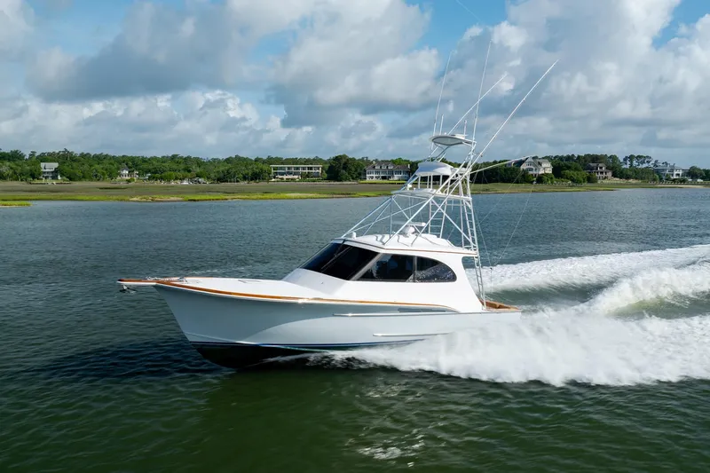 Slide: The Image of 2015 Jarrett Bay Hardtop Express Sportfish cruising on a scenic waterway. - 67