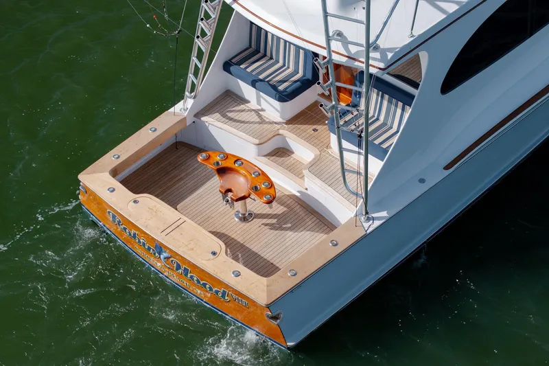 Slide: The Image of 2015 Jarrett Bay Hardtop Express Sportfish boat with elegant deck and seating on water. - 73