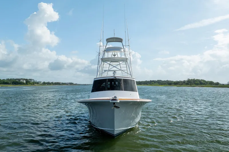 Slide: The Image of 2015 Jarrett Bay Hardtop Express Sportfish on calm water under a clear sky. - 76