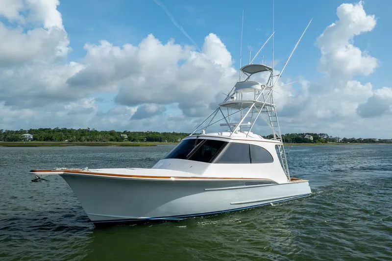 Slide: The Image of 2015 Jarrett Bay Hardtop Express Sportfish on calm water under blue sky. - 77