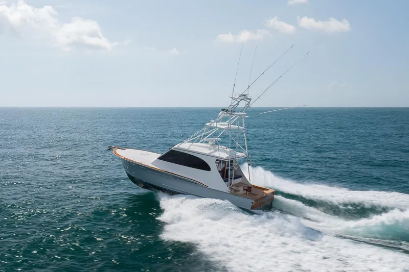 Slide: The Image of 2015 Jarrett Bay Hardtop Express Sportfish cruising on open ocean waters. - 86