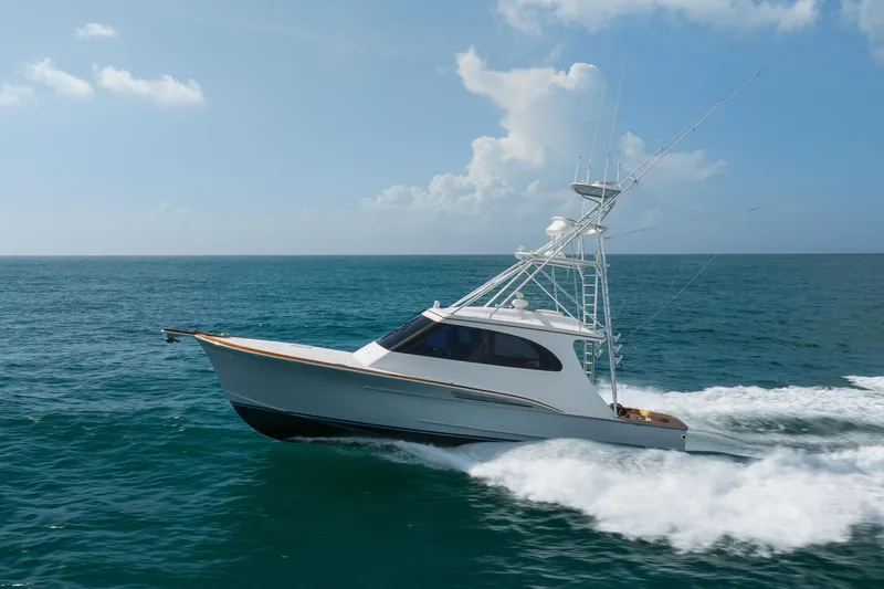 Slide: The Image of 2015 Jarrett Bay Hardtop Express Sportfish cruising on open ocean waters. - 87