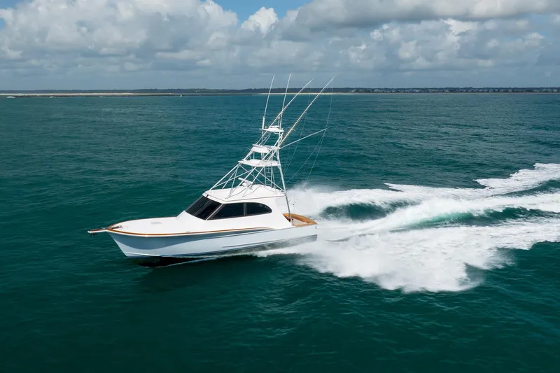 Slide: The Image of 2015 Jarrett Bay Hardtop Express Sportfish cruising on open ocean waters. - 89